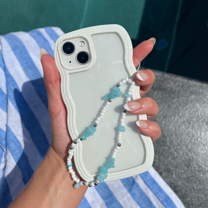 Clear Phone Case with Cream Curvy Edges.