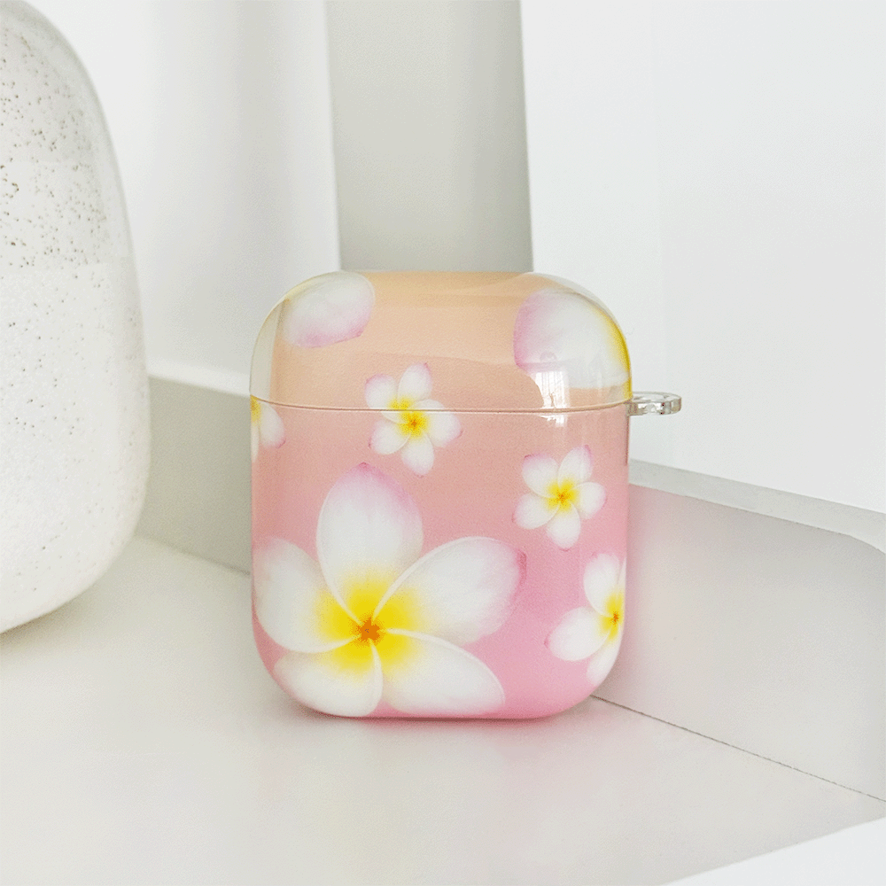 Pink AirPods Case with white hibiscus flower design.