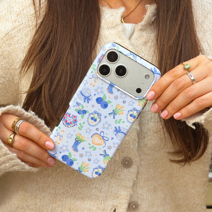 Girl holding blueberry picnic phone case close up image