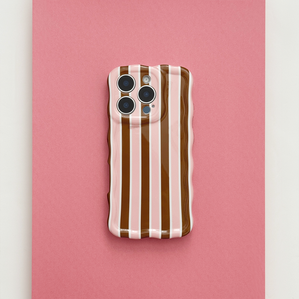 Rear view of Cocoa & Pink Stripe Wavy Phone Case featuring brown, pink and cream vertical stripes with a glossy finish on a pink background.