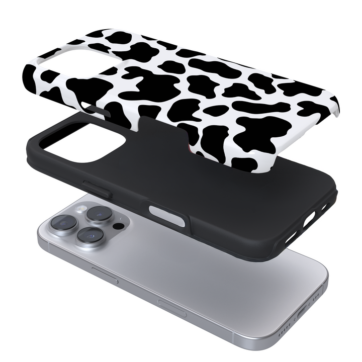 Expanded view of a phone case with cow print on a white background