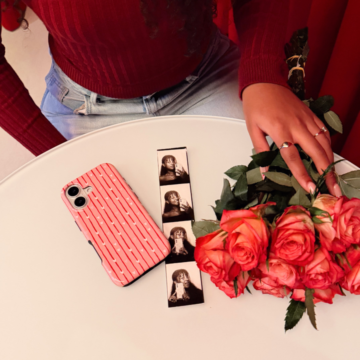 Love Drops Phone Case table flatlay image with flowers