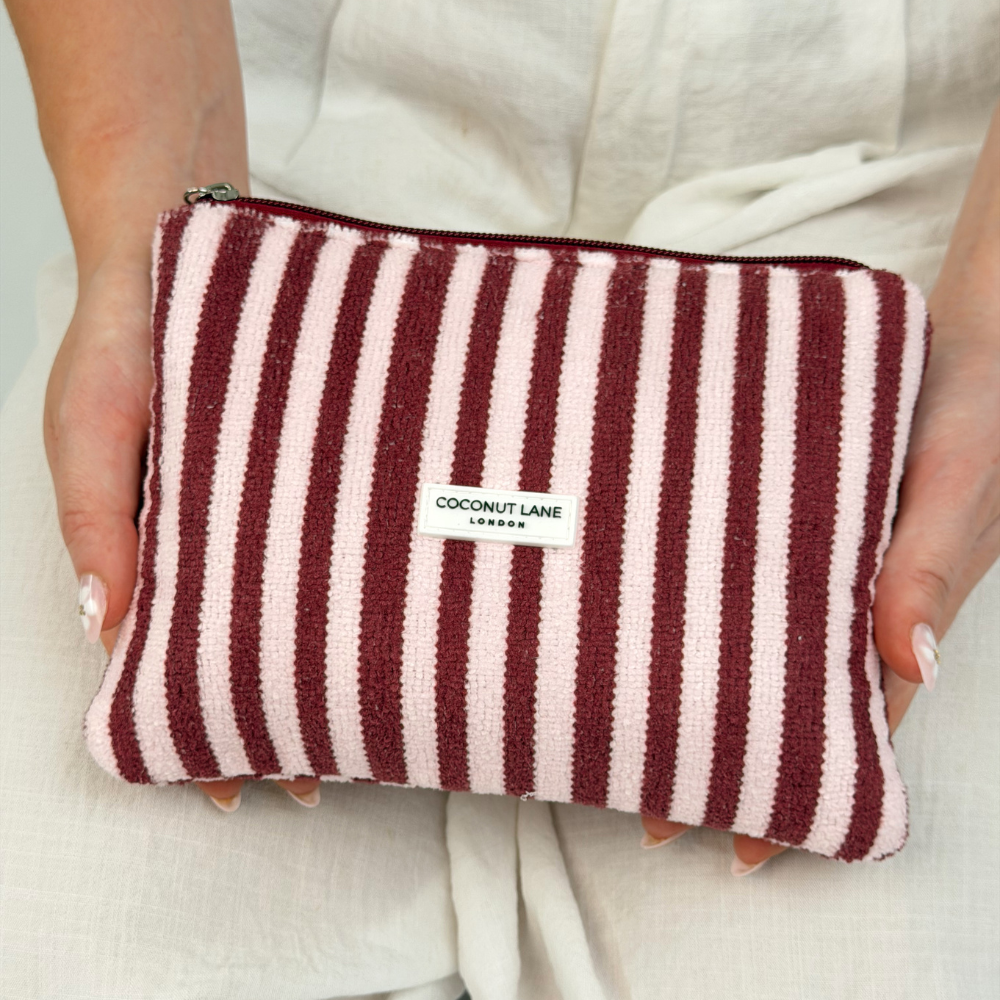 Close up of mini towel everything pouch blushberry stripes