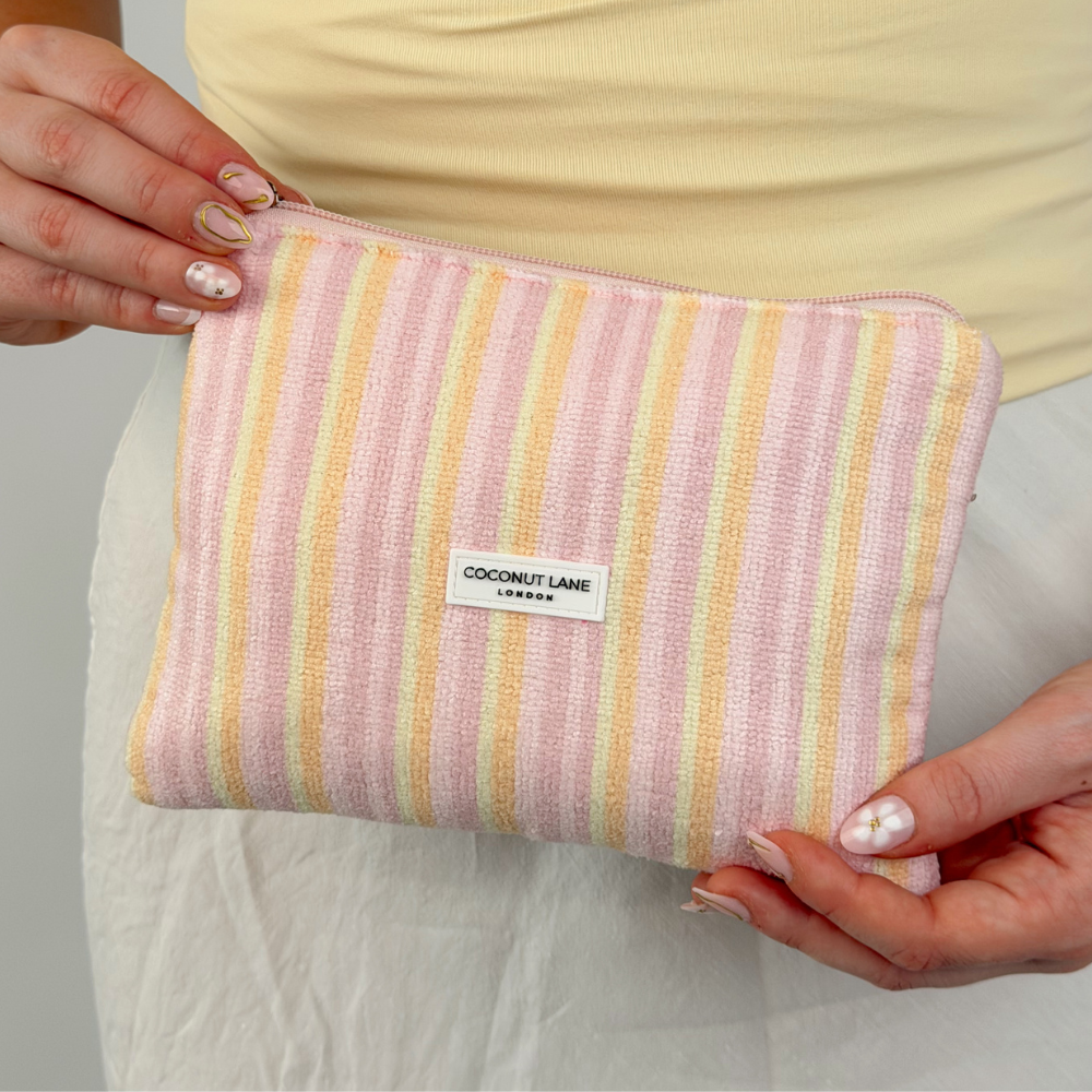 Close up image of mini towel everything pouch pastel stripes