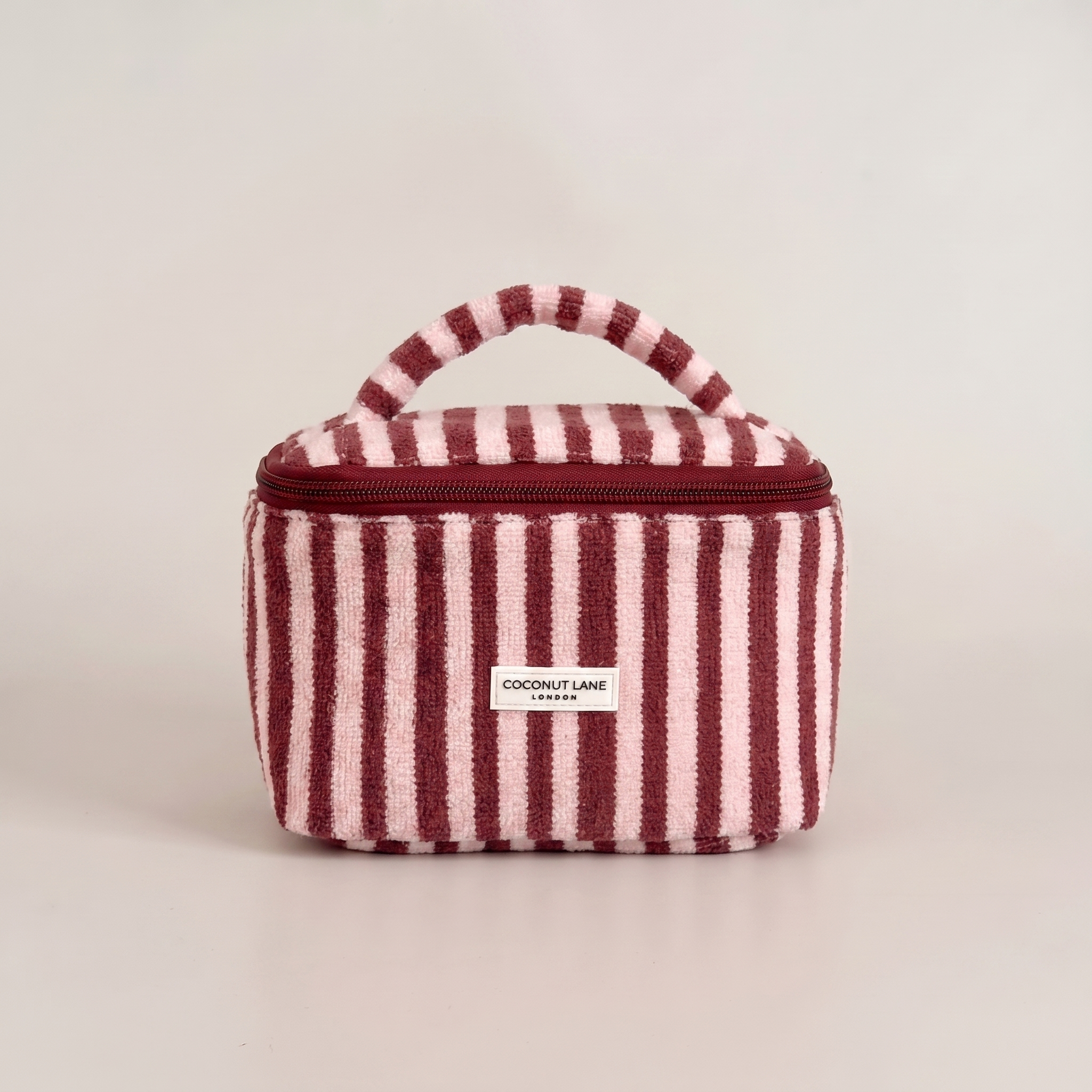 Burgundy and pale pink stripe small Vanity Bag with zip closure and padded handle.