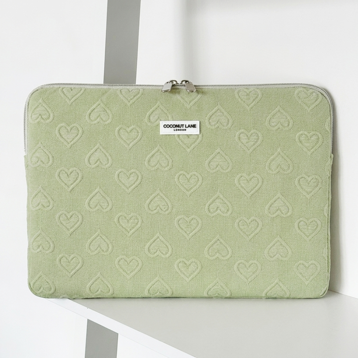 Green heart design Laptop Sleeve with zip closure and Coconut Lane logo. 