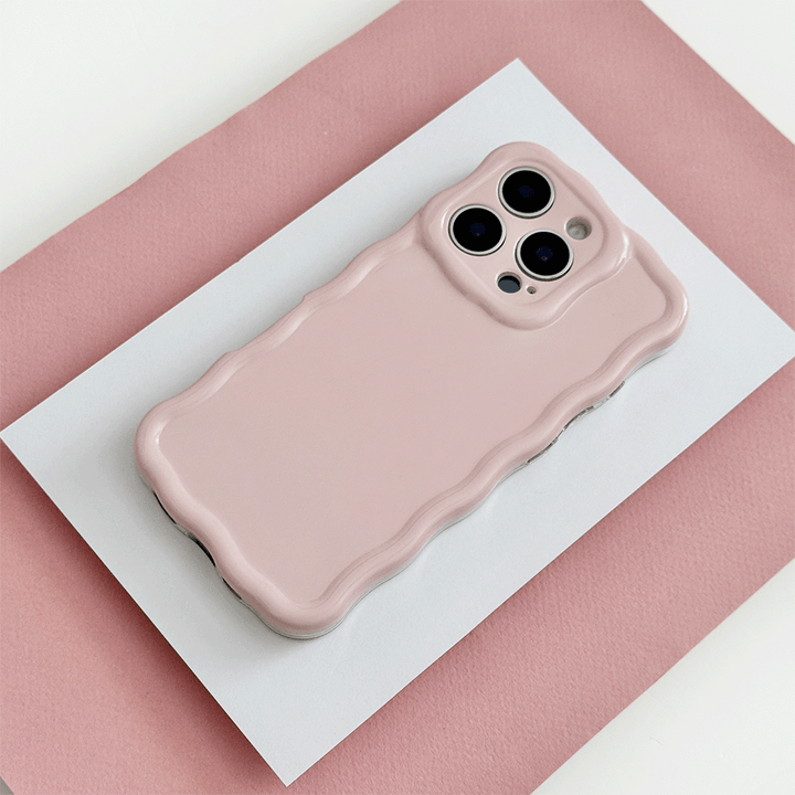 Plain baby pink coloured Phone Case with wavy edge effect.