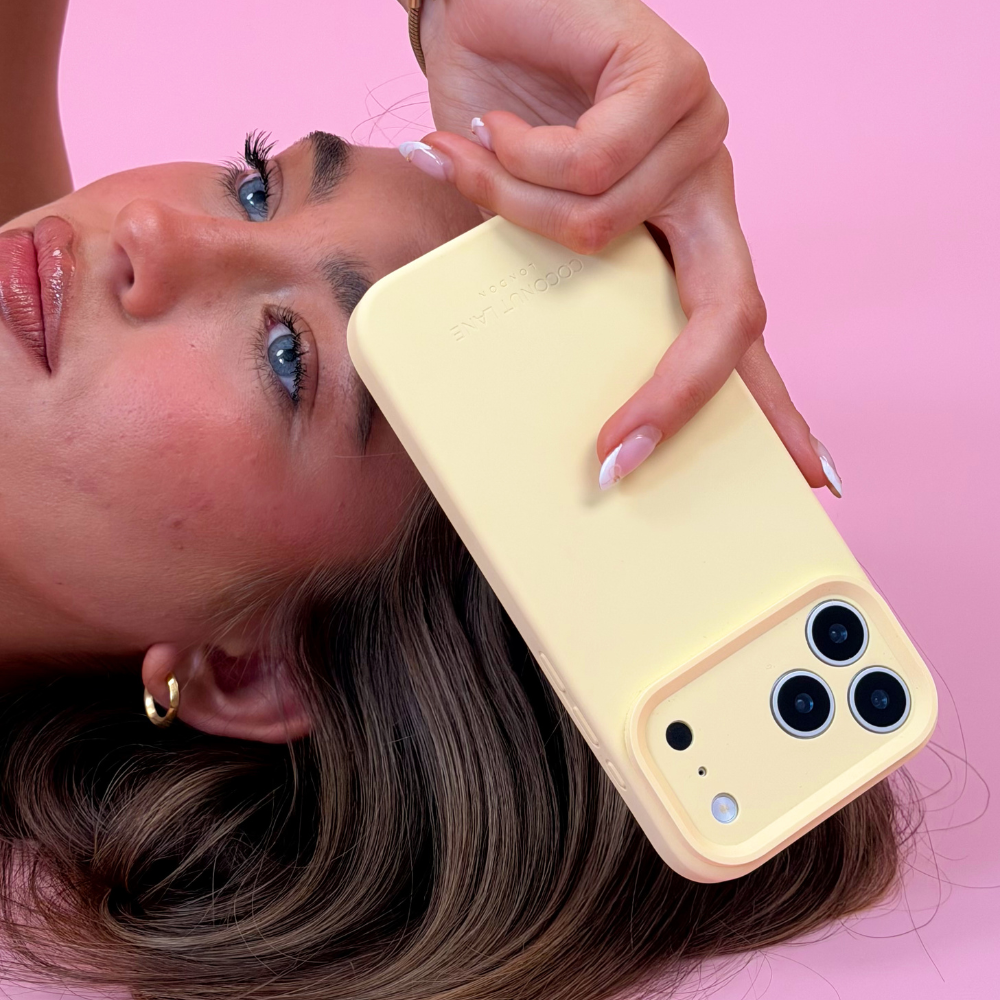 Girl holding butter soft butter yellow phone case close up