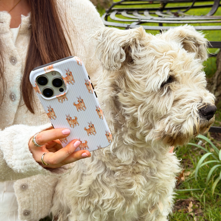 Hoppy Pup Tough Phone Case next to a white dog in a field