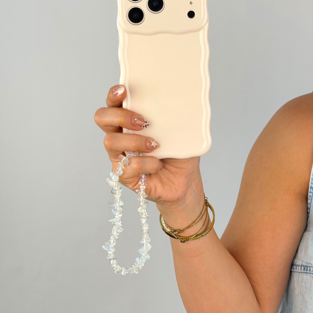 Wavy phone case with moonstone phone strap attached