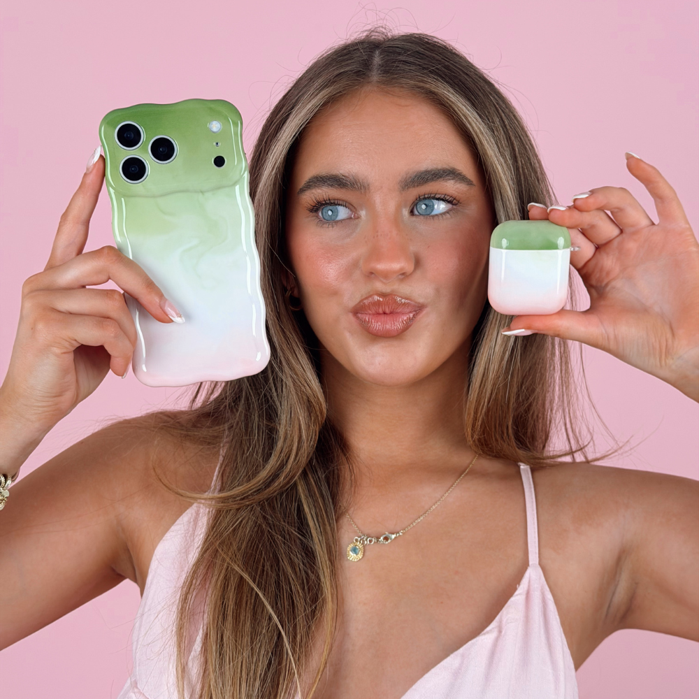 Studio pink photo of wavy strawberry matcha phone case with airpods case