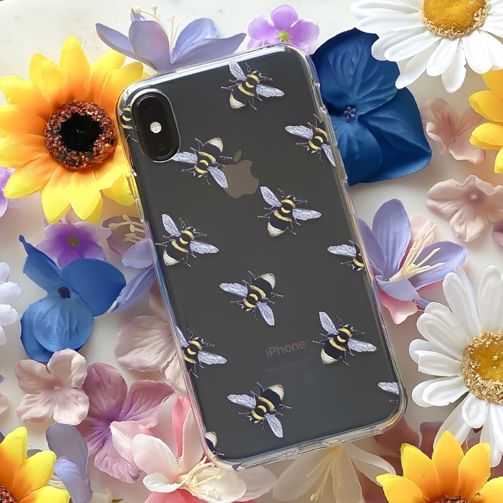 Bee Clear Phone Case surrounded by flowers
