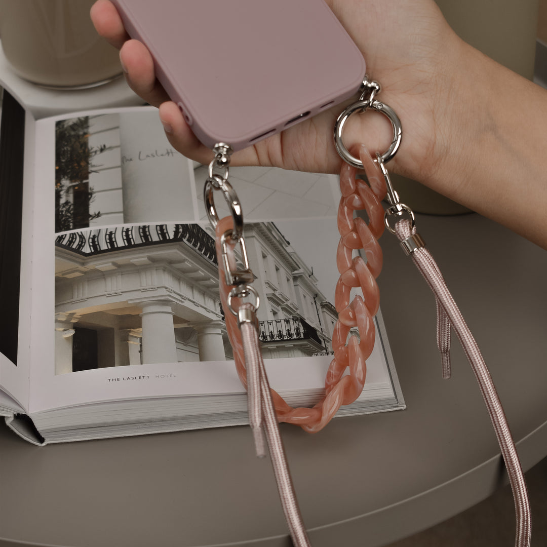 Pink-apple-phone-case-with-short-chain-strap-and-long-lanyard-strap