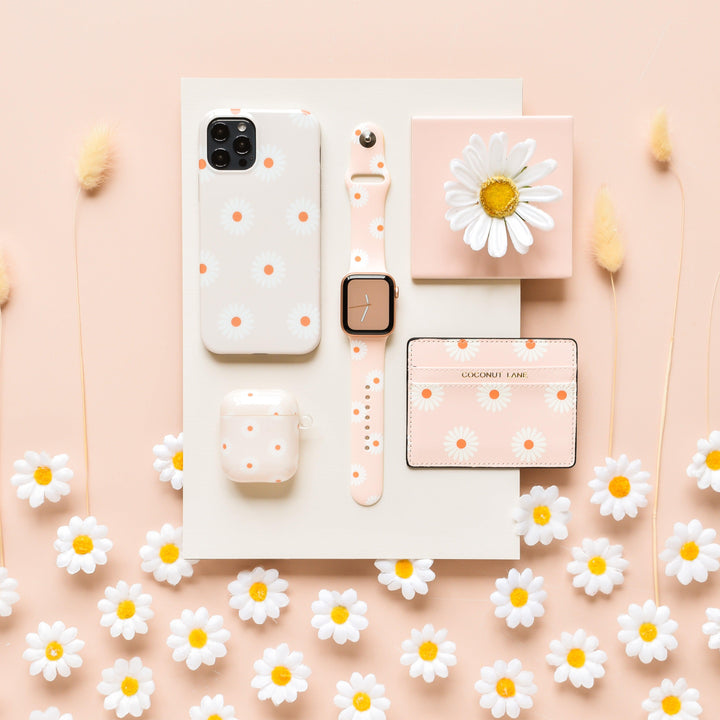 daisies-on-beige-background-tech-accessories