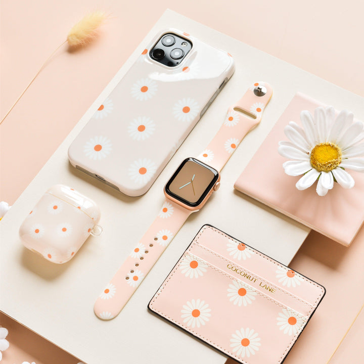 daisies-on-beige-background-tech-accessories