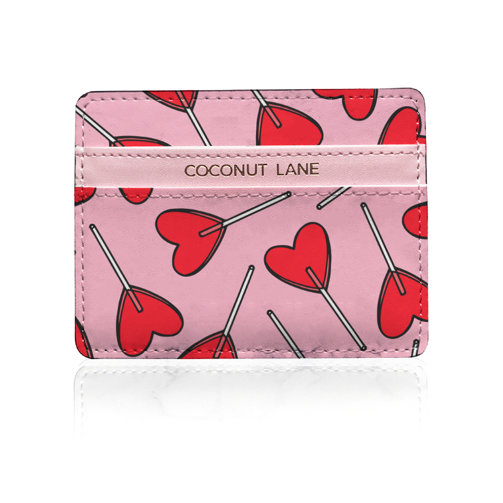 pink leather card holder with red candy heart design on white background